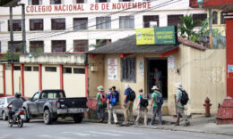 Students walking through a city during a Mercer On Mission: Ecuador trip