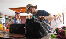 Students unpacking equipment during a Mercer On Mission: Ecuador trip