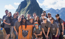 Mercer On Mission India & Peru team standing together in front of mountains