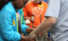 closeup photo of students working with rebar
