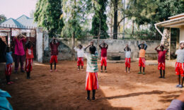 Tanzanian children playing a game outside