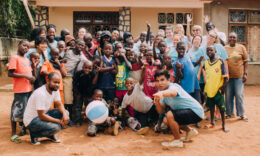 Mercer Students standing together with Tanzanian children