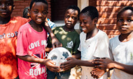 Tanzanian children holding a ball