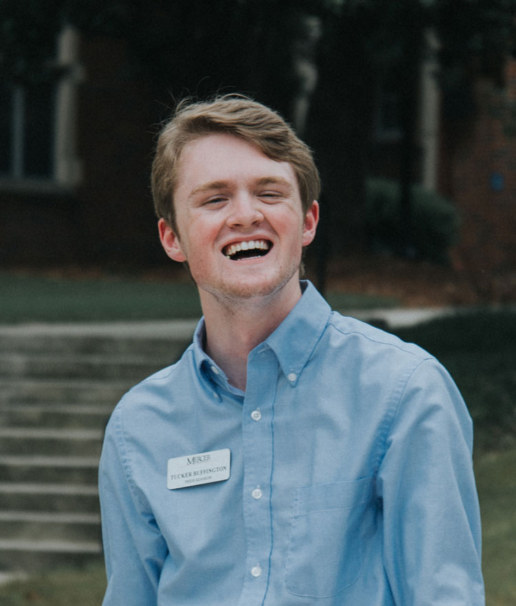 Smiling Student wearing a Mercer name tag