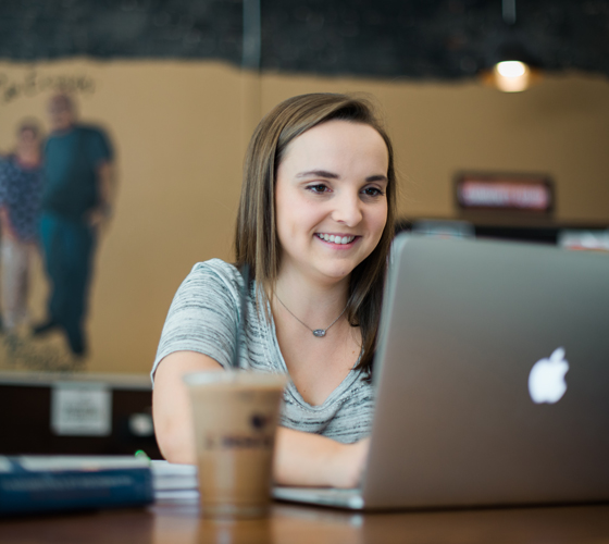 Mary Connell studying with laptop in ZBeans