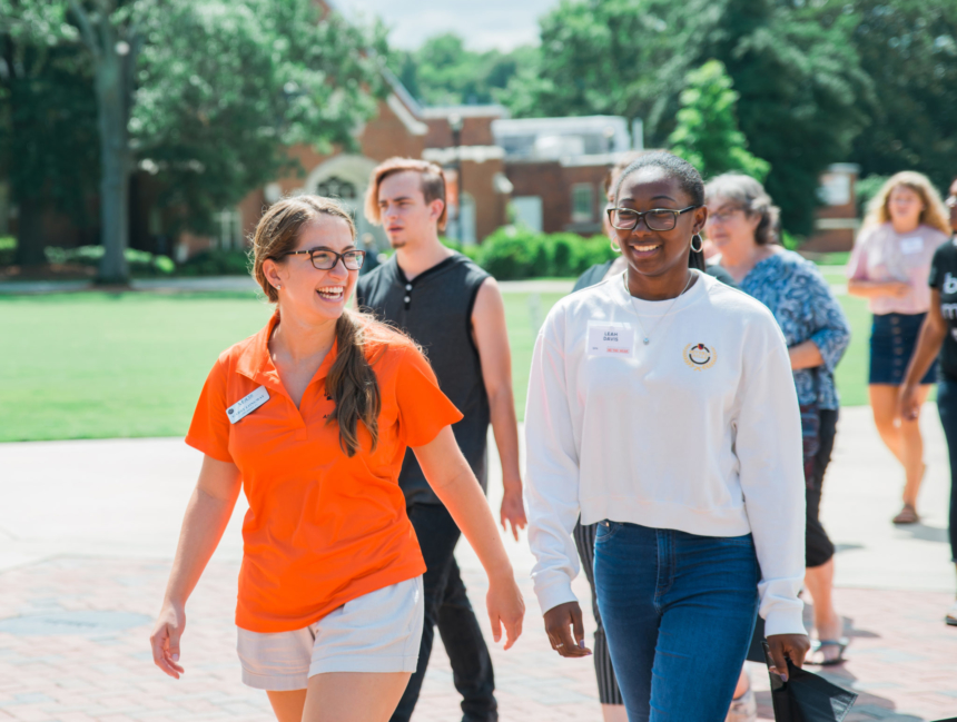 Admissions student worker leading a tour