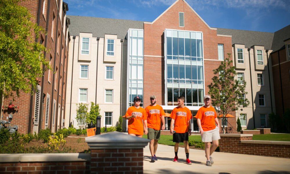 Percer student volunteers on opening day walking in front of Legacy Hall