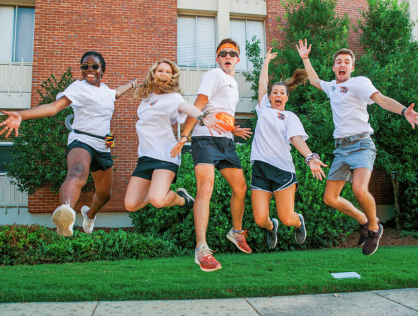 Students excitedly jumping in the air