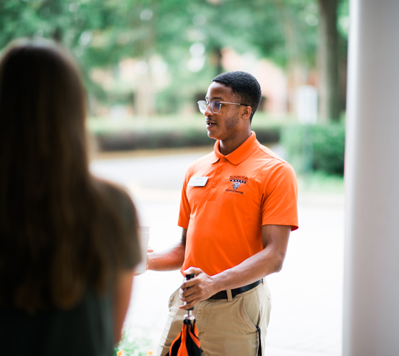 Admissions student worker leading a tour