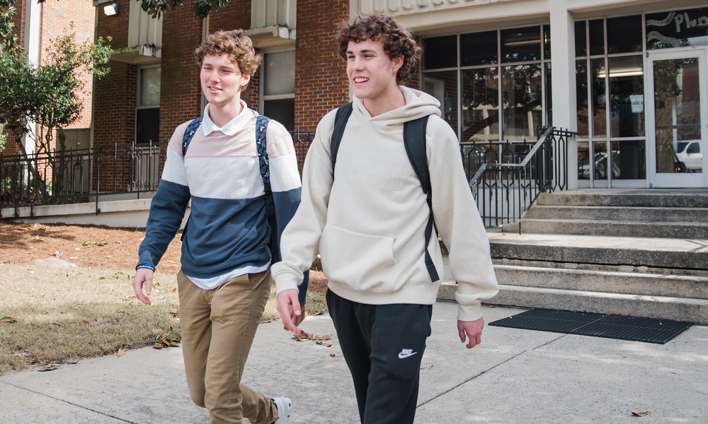 Dylan Sanfilippo and Colin Ralph walking out of Plunkett Hall