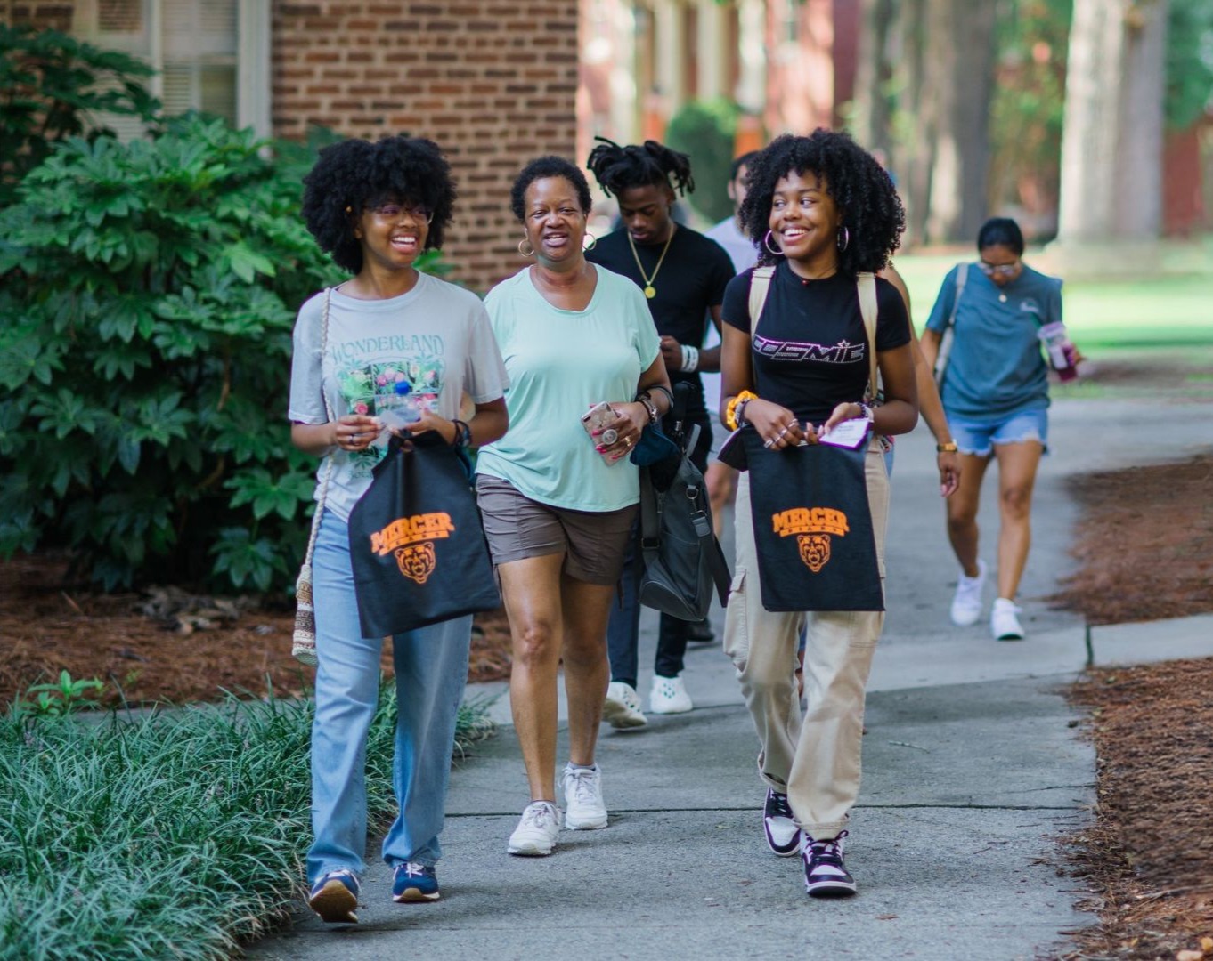 Student admissions worker leading a tour
