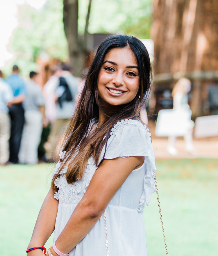 Student posing for a photo at convocation