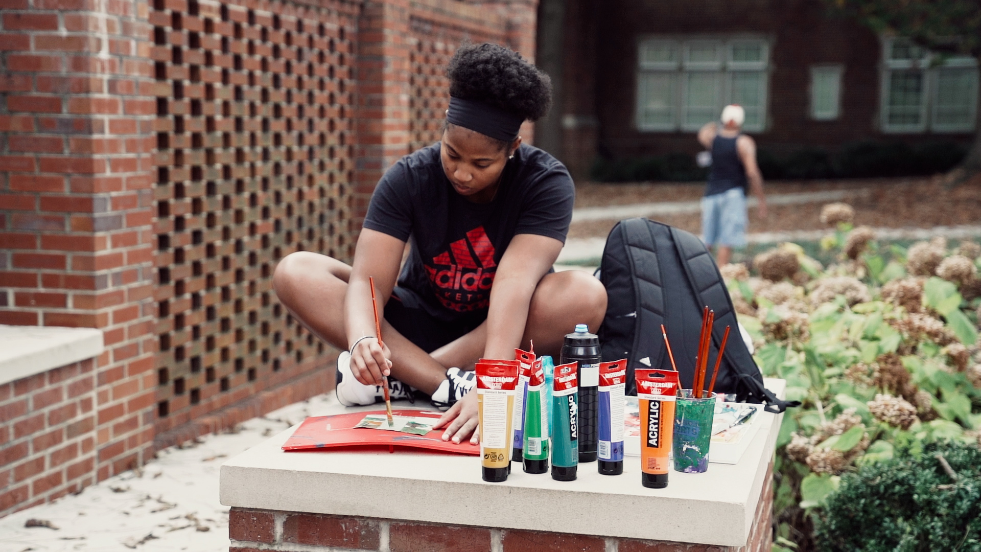 Photo of a Mercer student painting