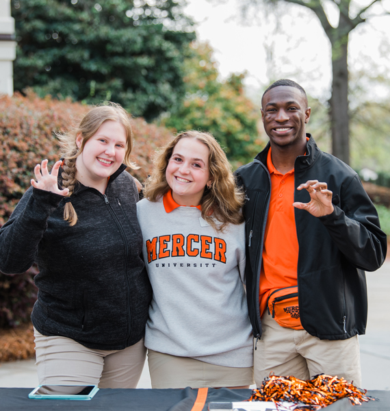 Three Mercer students posing for a photo outside before the Business, Engineering, and Technology Preview