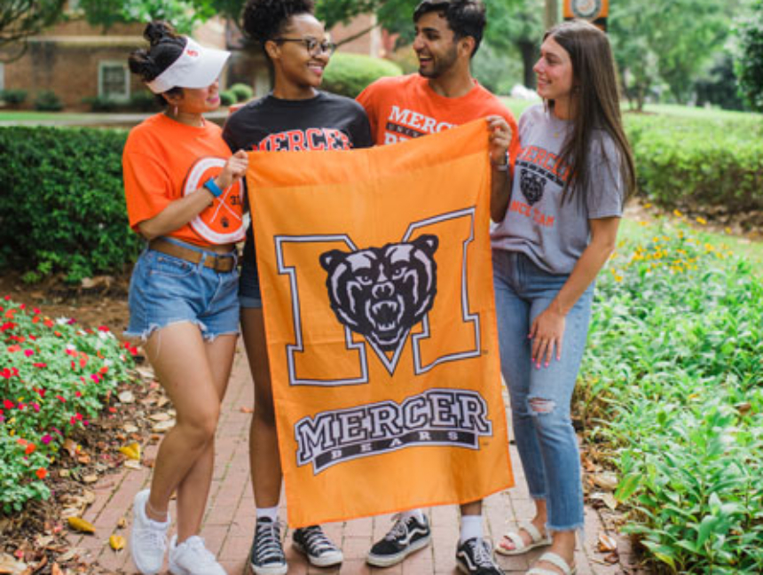 Mercer University students holding flag