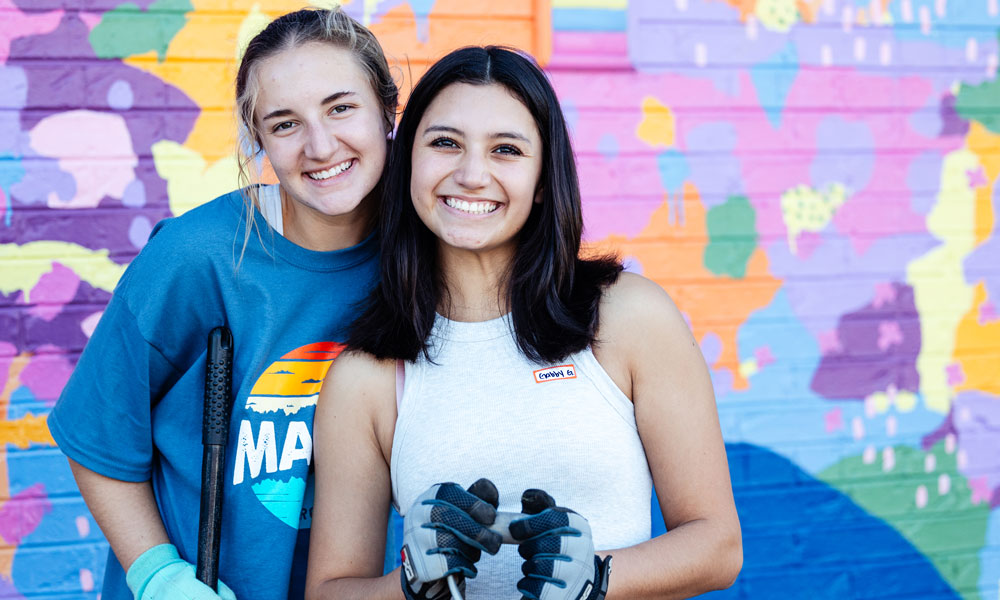 Two students smiling at camera during Be A Good Neighbear