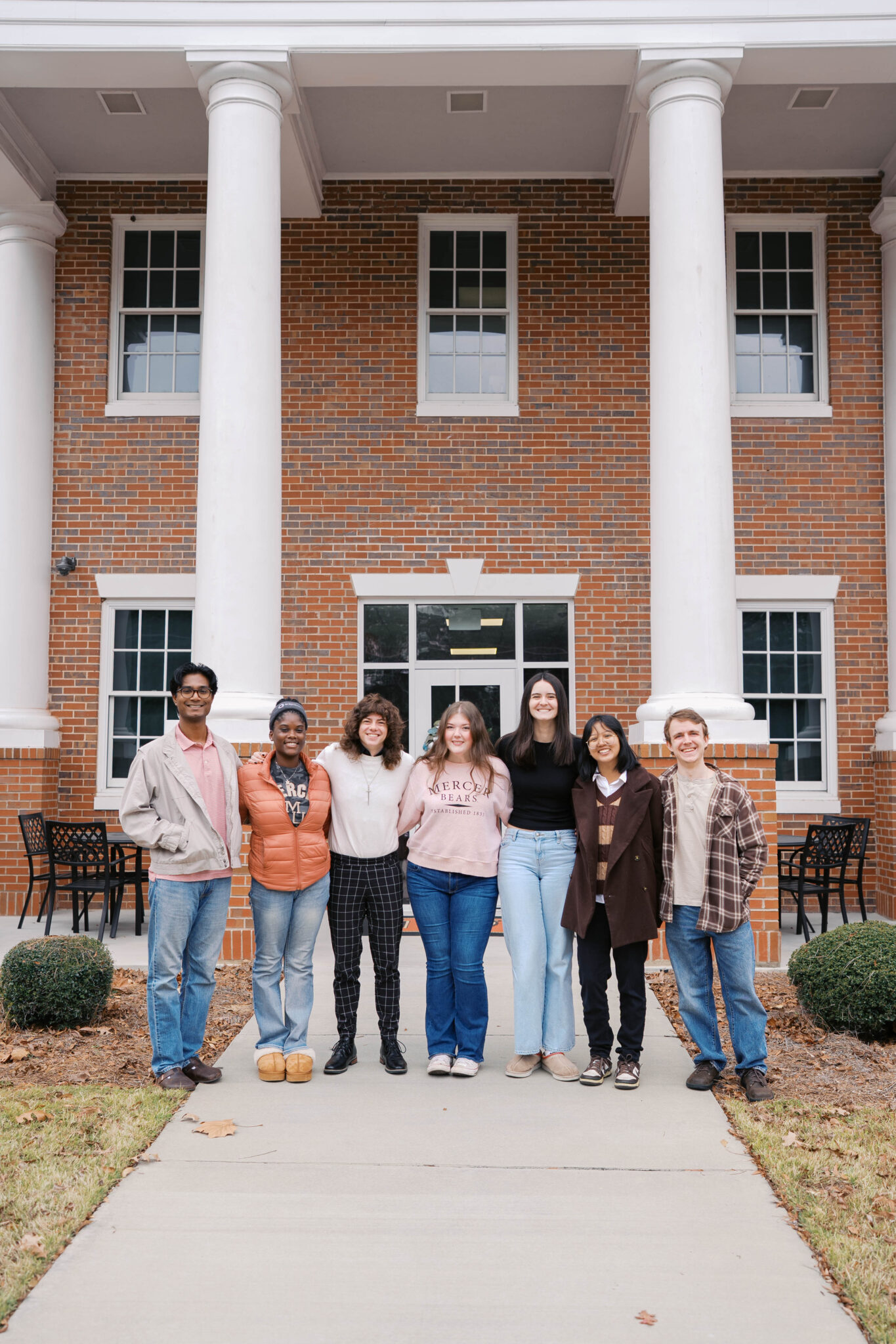 Photo of Macon undergraduate students stood outside Stembridge Center for Student Success