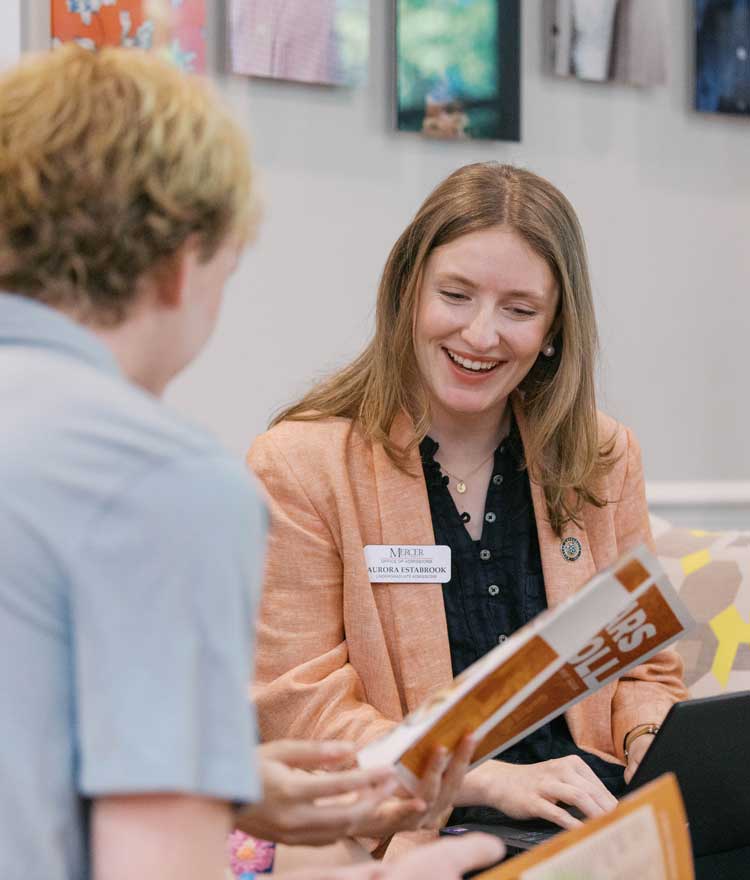 Admissions counselor talking to student