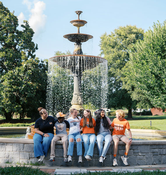Students sitting by Tattnall Fountain